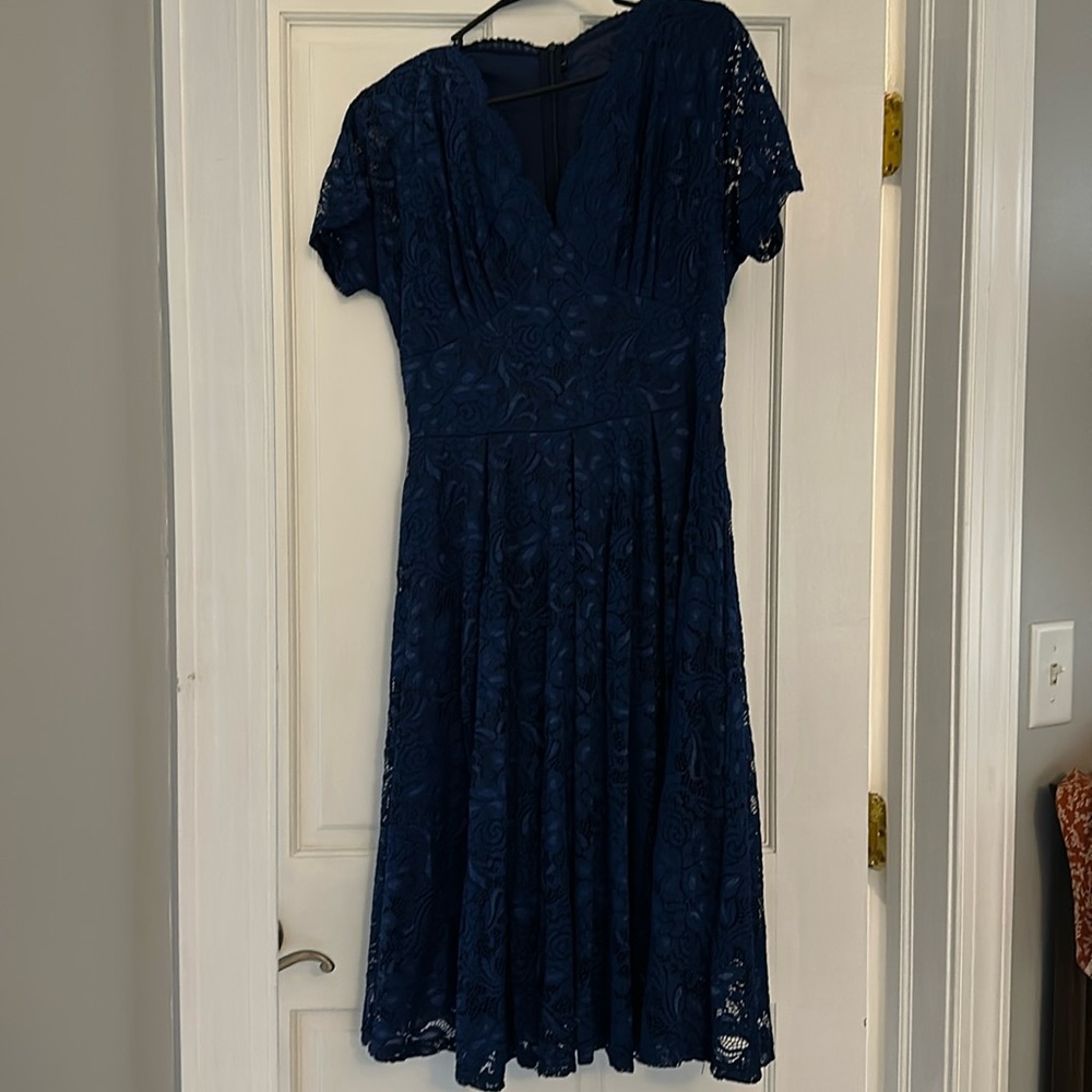 Never worn. Navy Blue